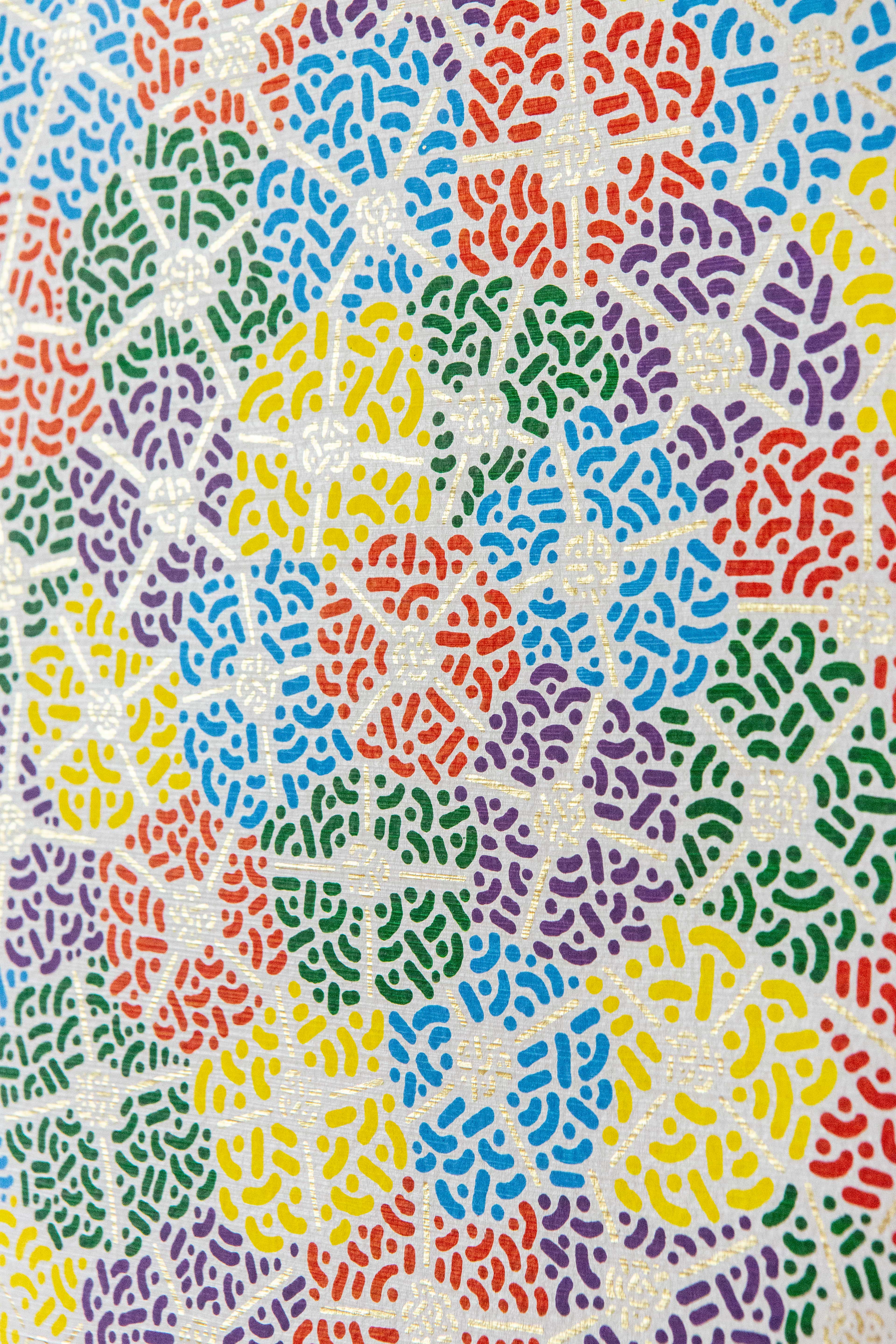 Spring Fest II: Close-up of brightly colored patterned circles overlapping on a pale background.