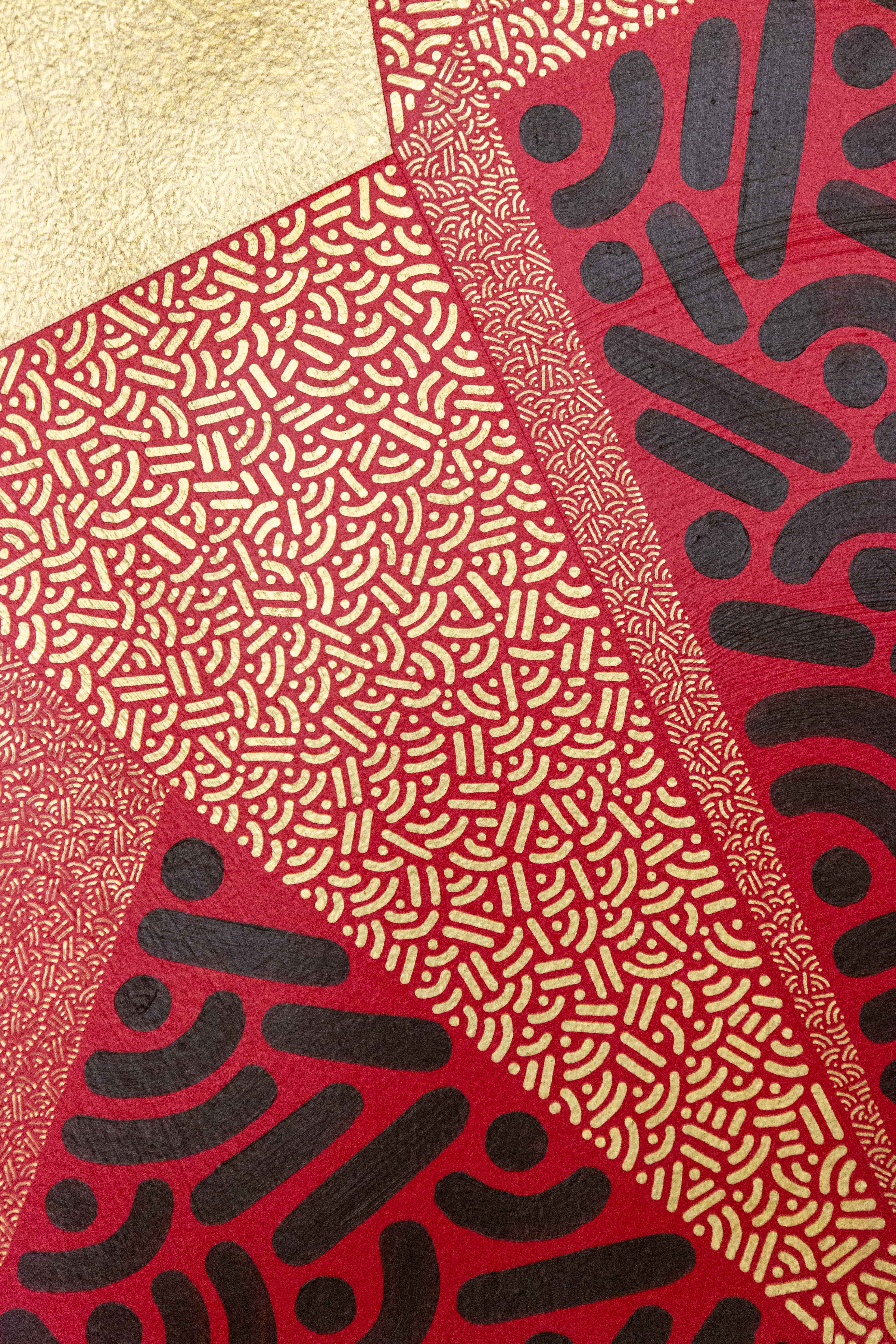 Radiant Convergence: Detail of copper and gold pointed shapes crossing a red-and-black patterned background.
