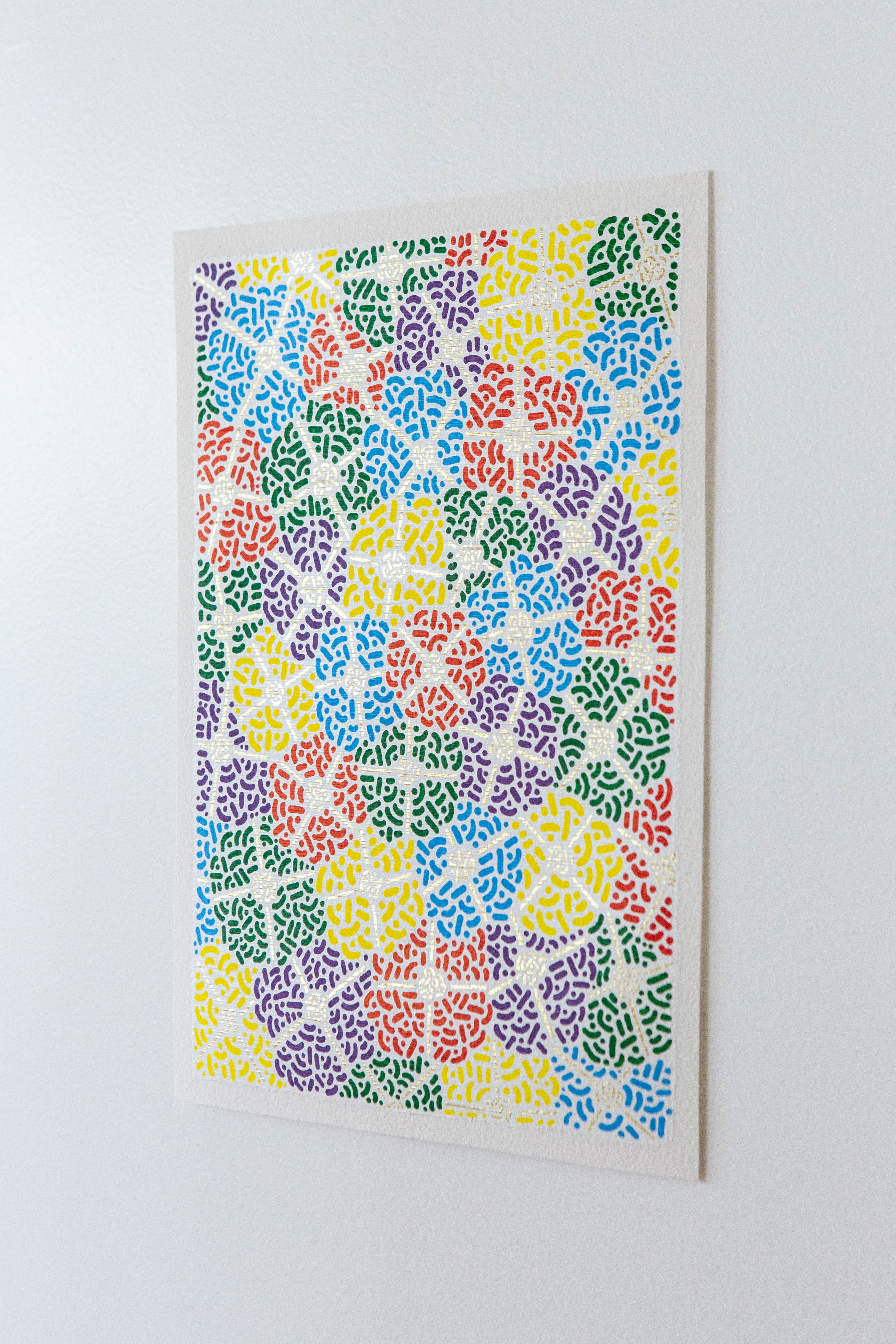 Spring Fest II: Colorful artwork of overlapping patterned circles displayed on a white wall.