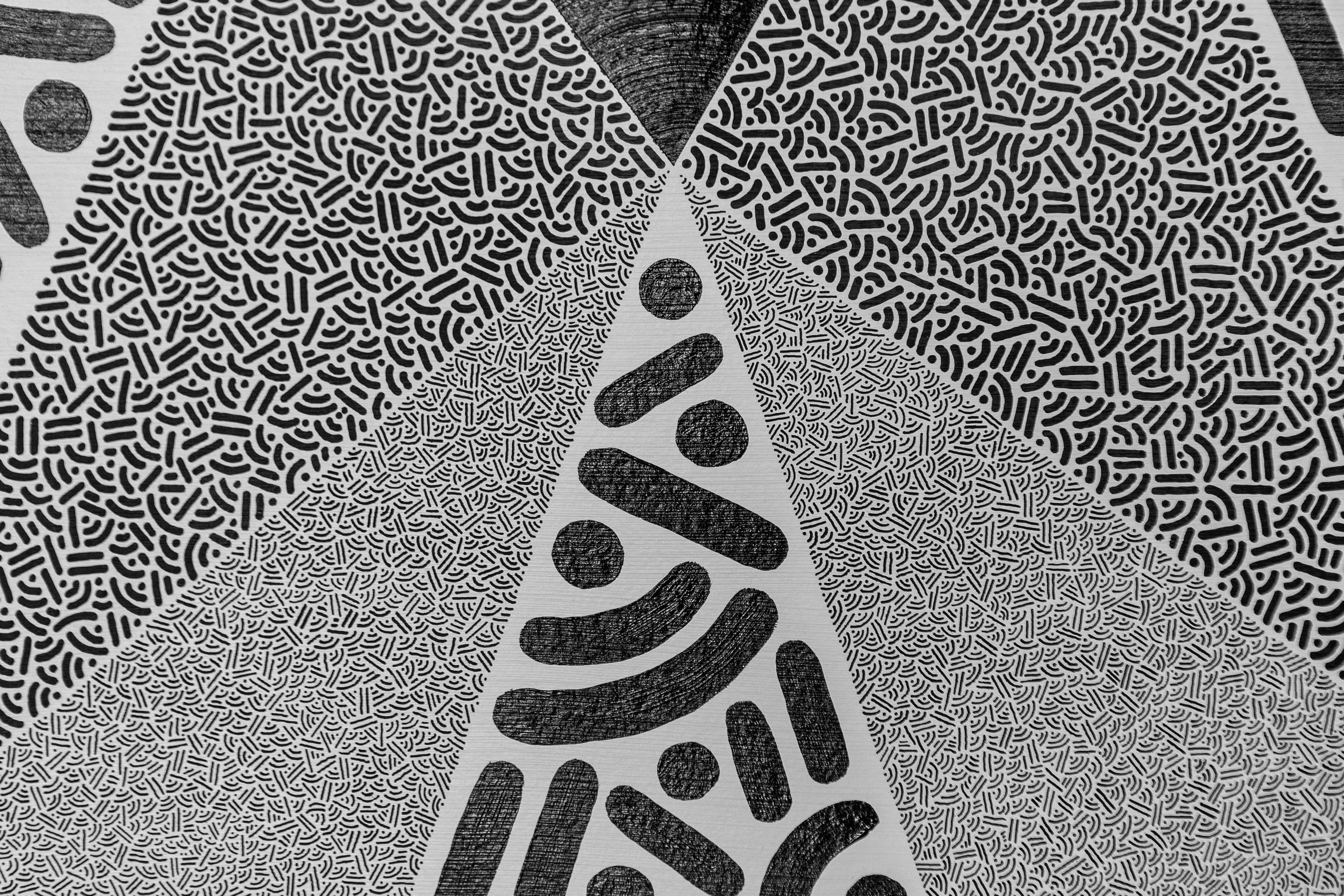 Singularity: Detail of gray triangles and black dots and curves, with fine patterned marks between the larger shapes.