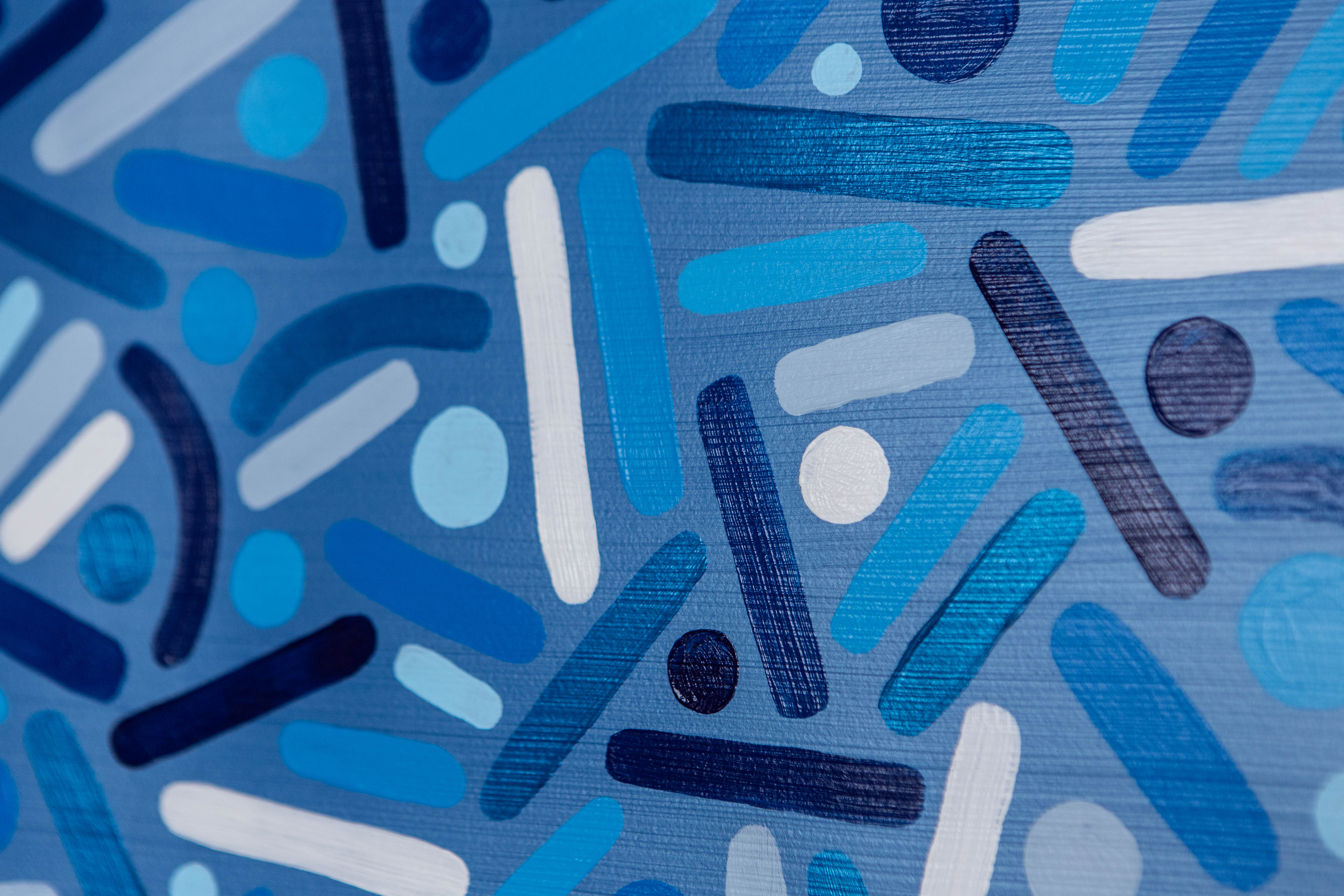 Ocean Frequency: Close-up of overlapping dark-blue, turquoise, and white dots and curves.