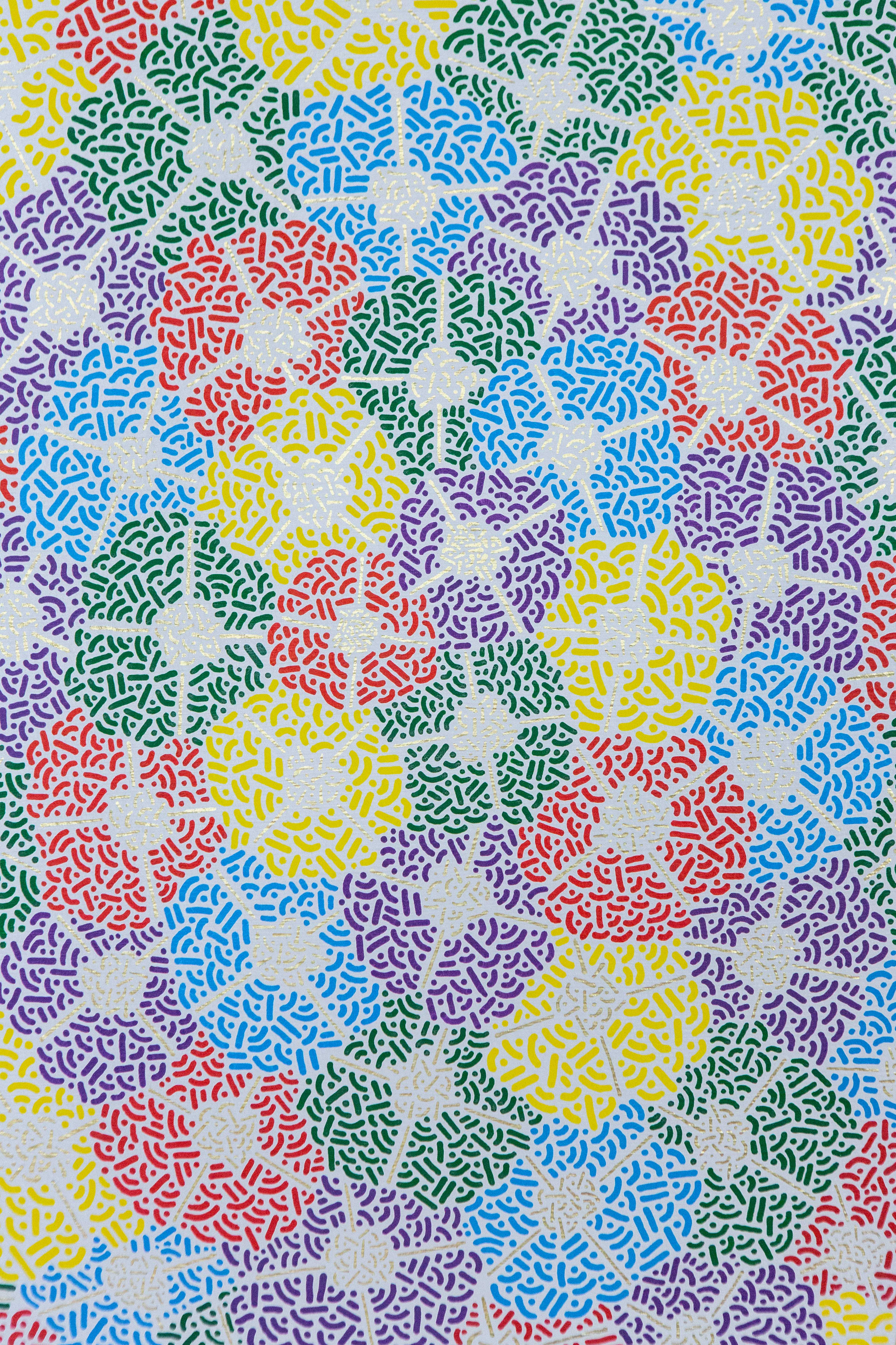 Spring Fest: Close-up of brightly colored patterned circles overlapping on a pale background.