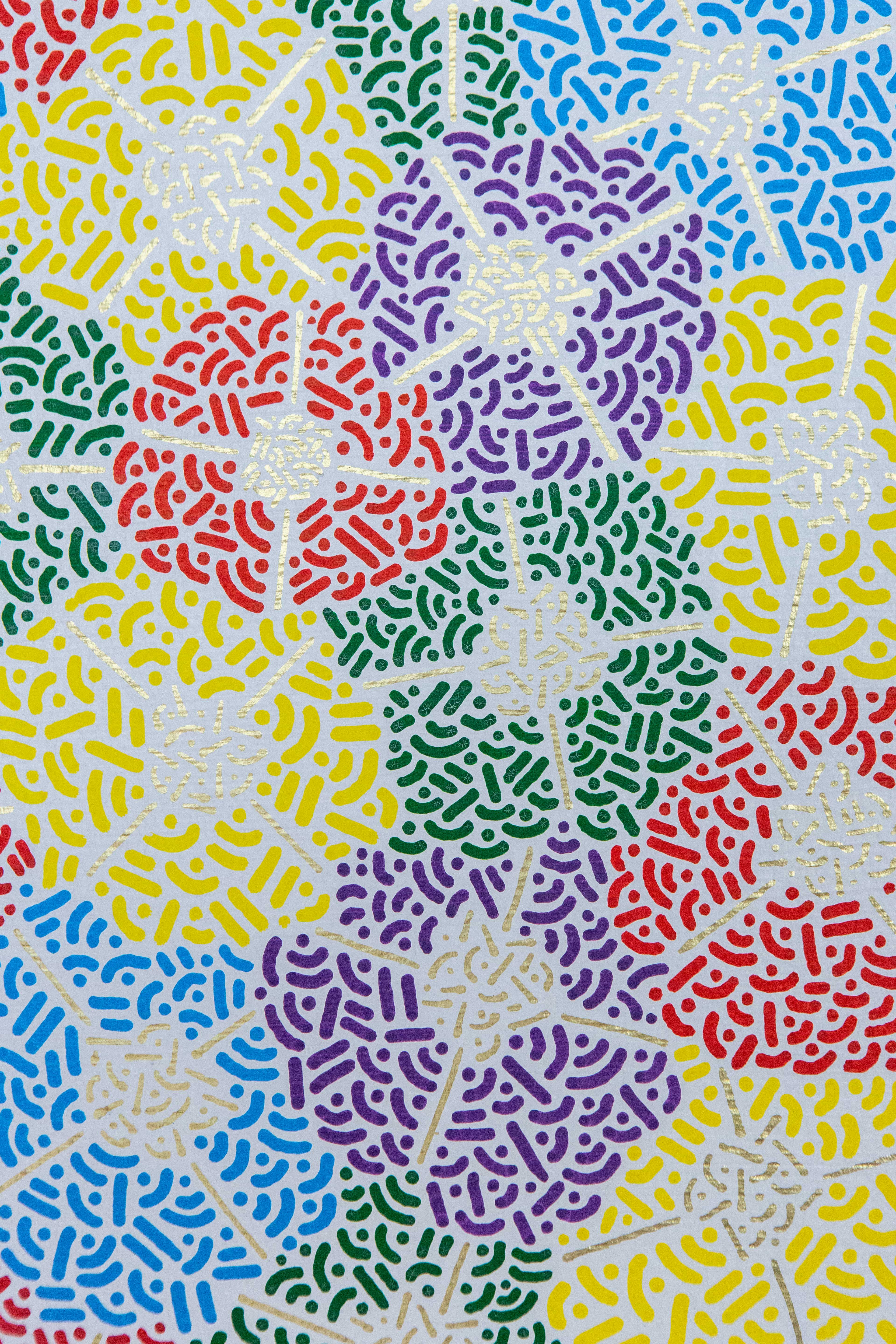 Spring Fest: Close-up of brightly colored patterned circles overlapping on a pale background.