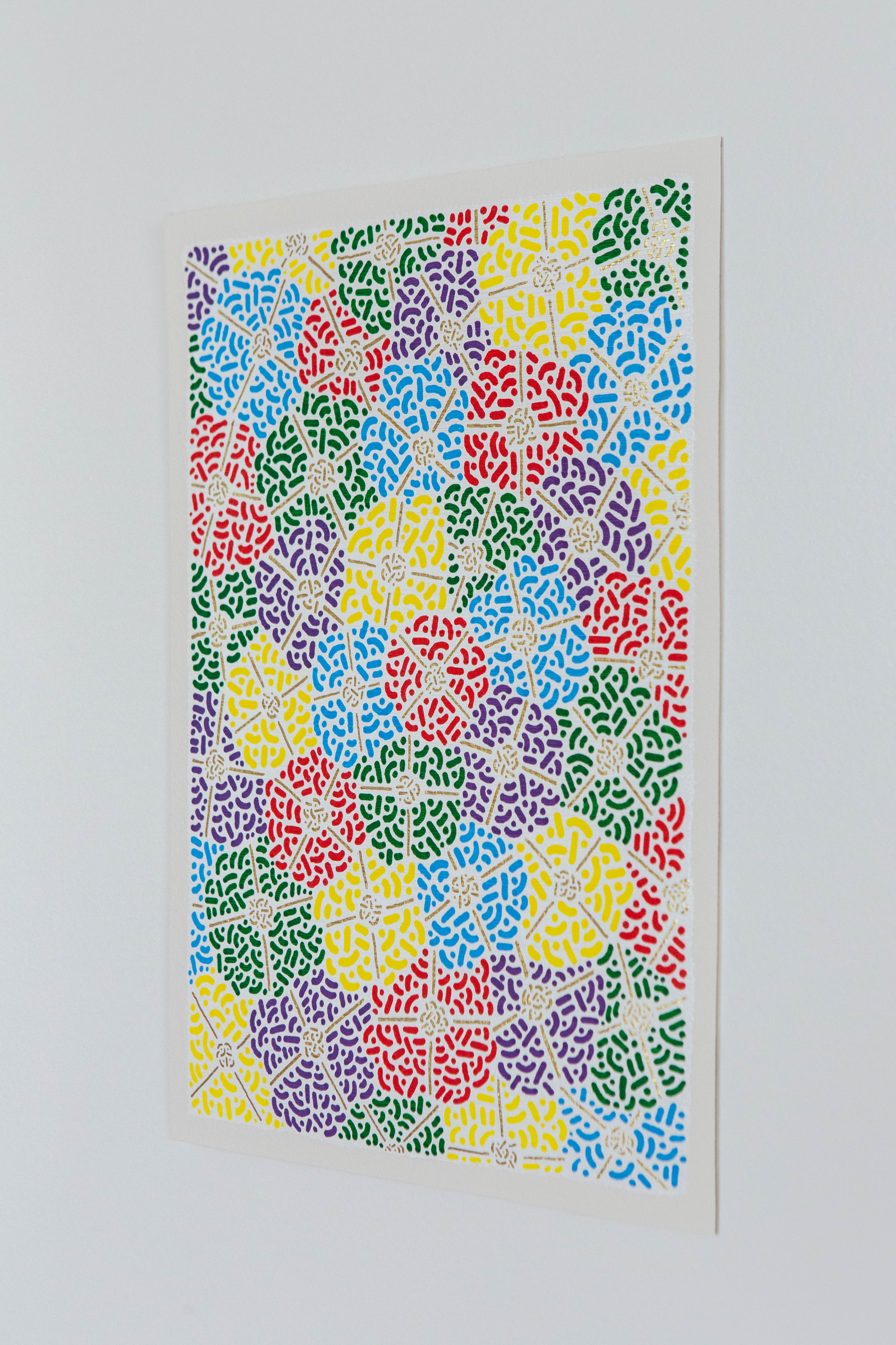 Spring Fest II: Colorful artwork of overlapping patterned circles displayed on a white wall.